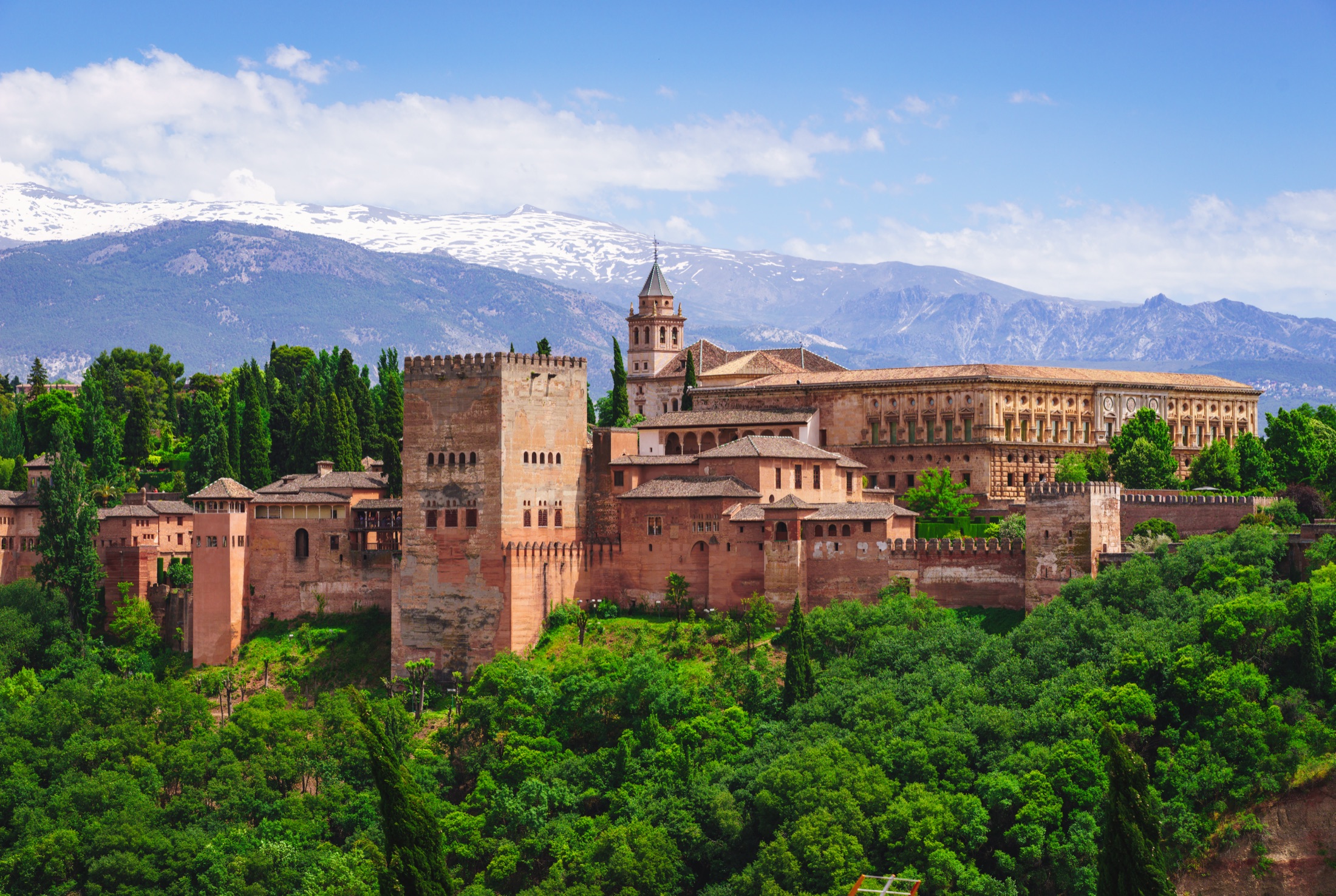 Alhambra towers with Sierra Nevada mountains